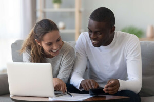 A couple reviewing their homeowners insurance policy.