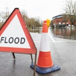 Flood sign in road