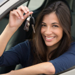 Young,Happy,Woman,Showing,The,Key,Of,New,Car