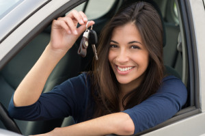 Young,Happy,Woman,Showing,The,Key,Of,New,Car