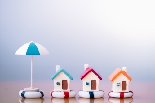 Home,Insurance.,House,Model,In,Lifebuoys.,Securing,Large,Value,Of