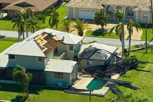 A home and pool with major damage.