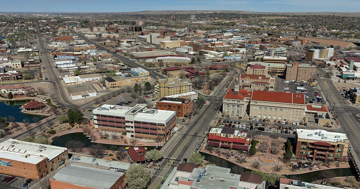 Aerial view of downtown Pueblo, Colorado (pop. 111,876), featuring the historic Arkansas Riverwalk. Pueblo, Colorado