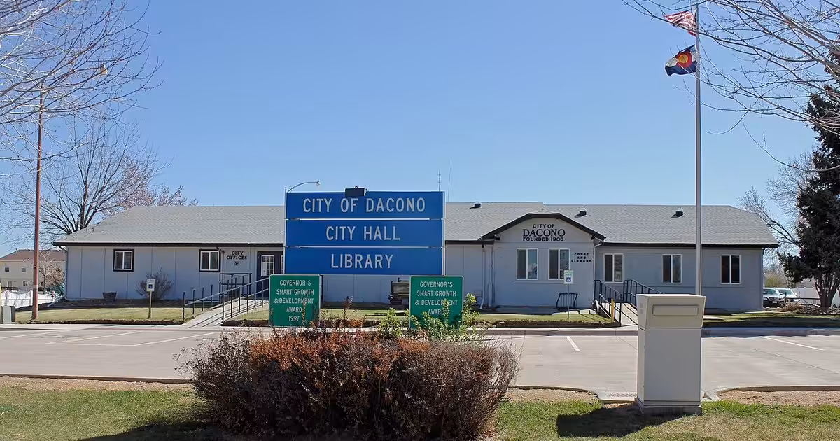 The city hall and library in Dacono, Colorado. The location is 512 Cherry Street in Dacono, Colorado. Dacono, Colorado
