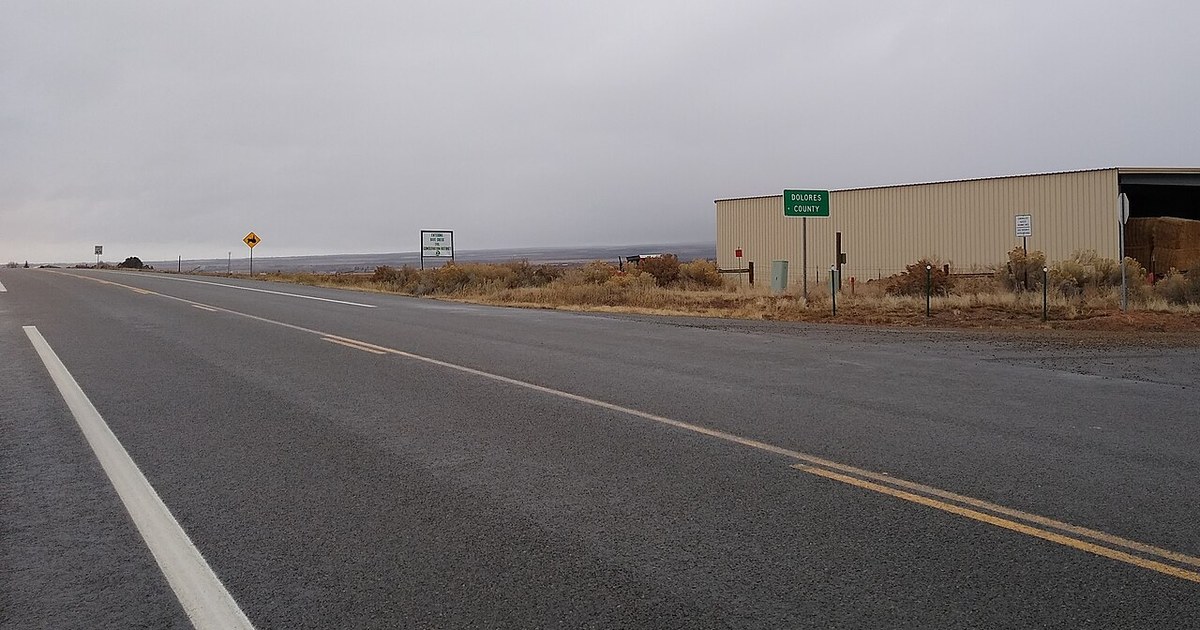Sign on U.S. Route 491 marking the border between Montezuma County and Dolores County, Colorado. Dolores County line