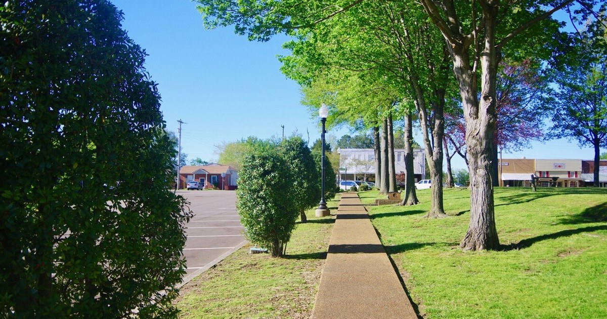 Sidewalk along the Town Square in Troy, Tennessee, United States. Troy-Town-Square-sidewalk-tn