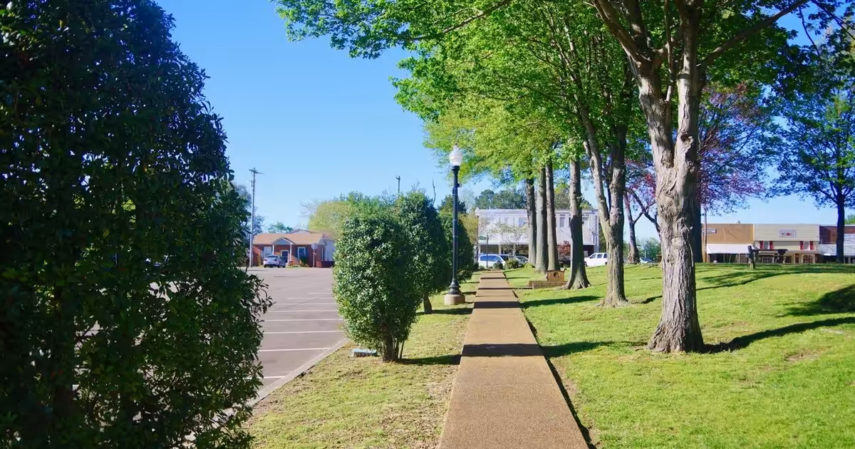 Sidewalk along the Town Square in Troy, Tennessee, United States. Troy-Town-Square-sidewalk-tn