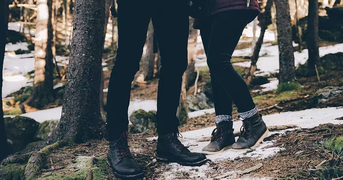 Roan Mountain, United States Couple in a wintry forest (Unsplash)