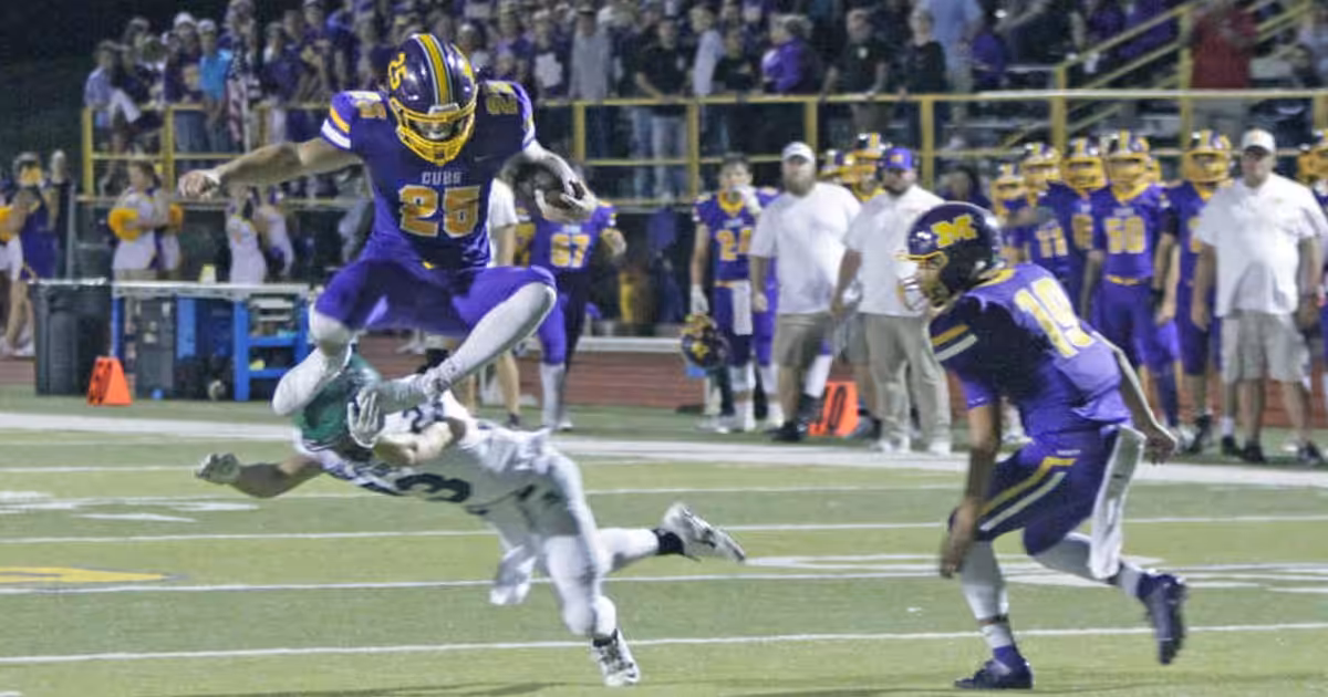 Monett Football player mid air Monett Football